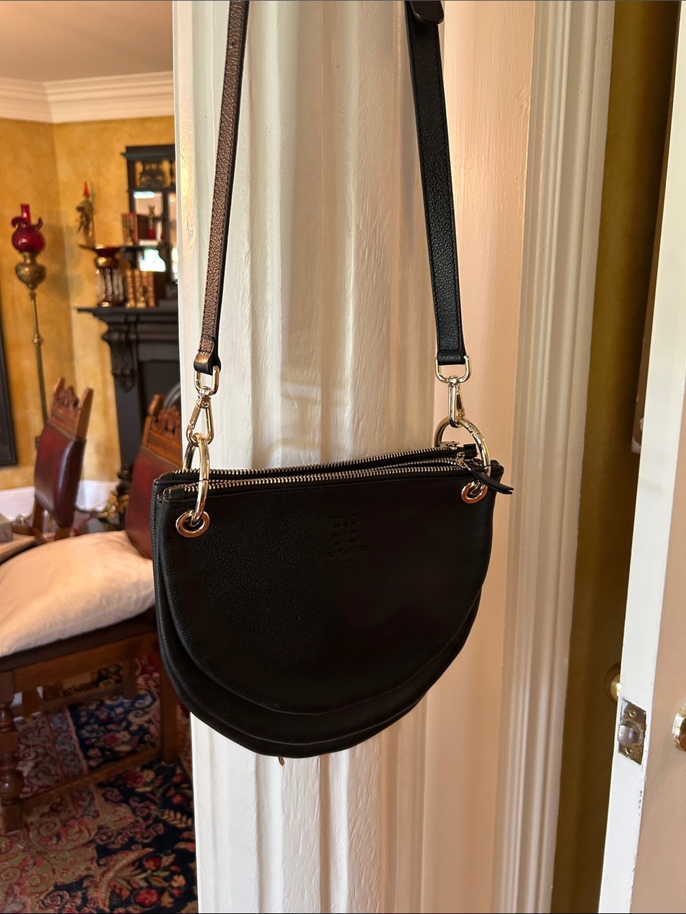Black Leather Half-Moon Crossbody Bag with Adjustable Strap